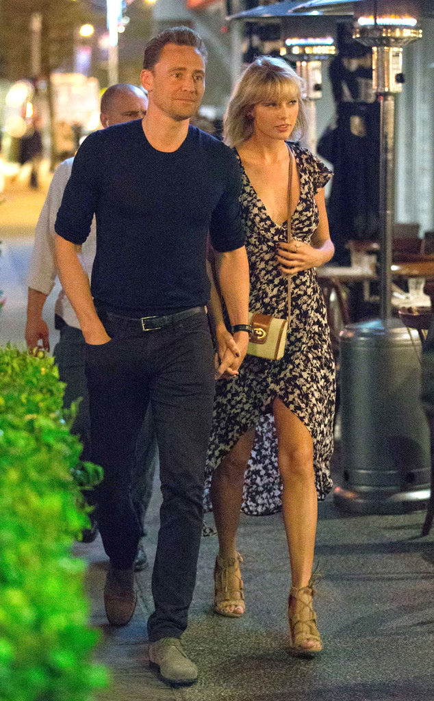 Taylor Swift and Tom Hiddleston holding hands
