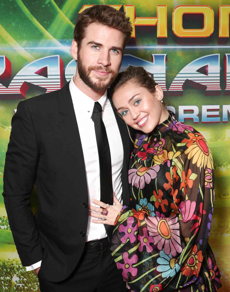 Miley Cyrus and Liam Hemsworth at an event