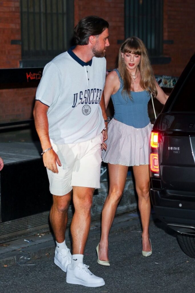 Taylor Swift and Travis Kelce holding hands