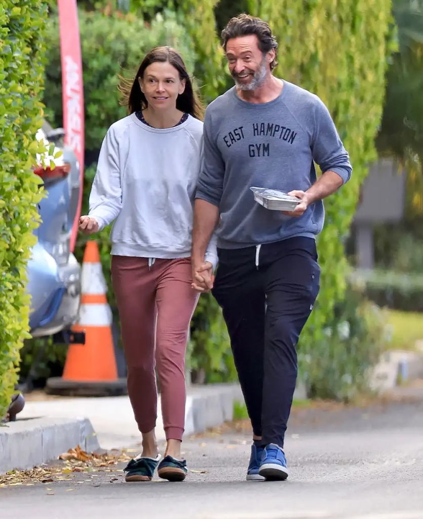 Hugh Jackman and Sutton Foster walking
