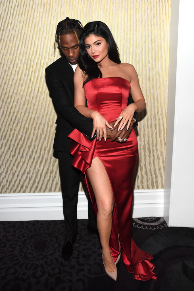 Kylie Jenner and Travis Scott holding themselves