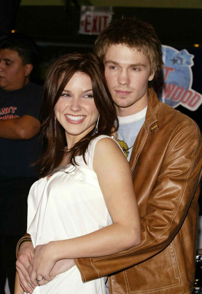 Sophia Bush and Chad Michael Murray holding each other