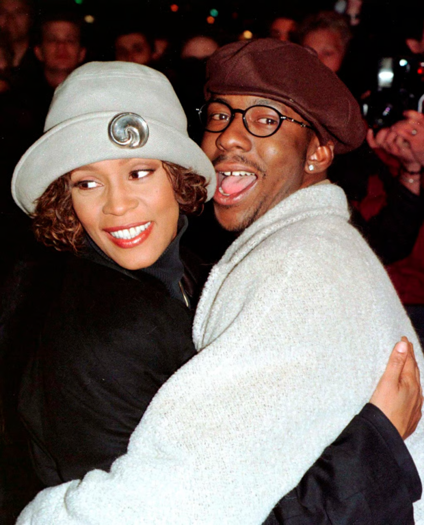 Whitney Houston and Bobby Brown hudgging