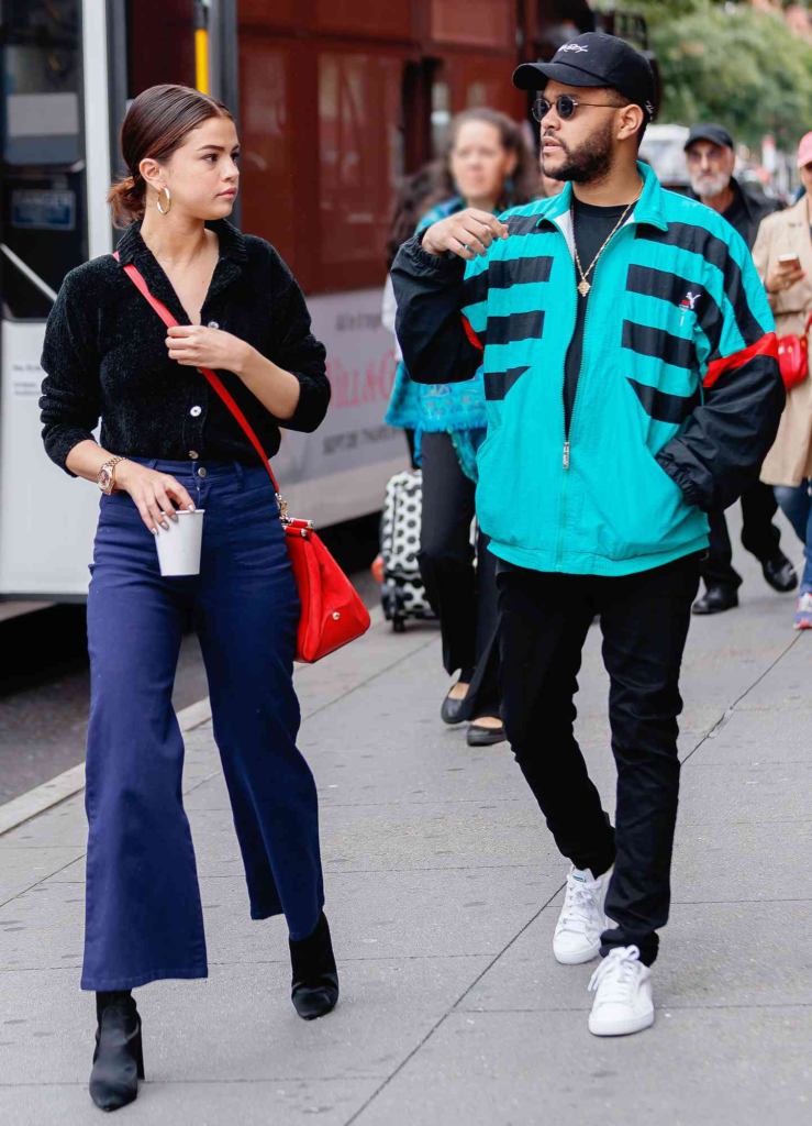 Selena Gomez and The Weeknd walking