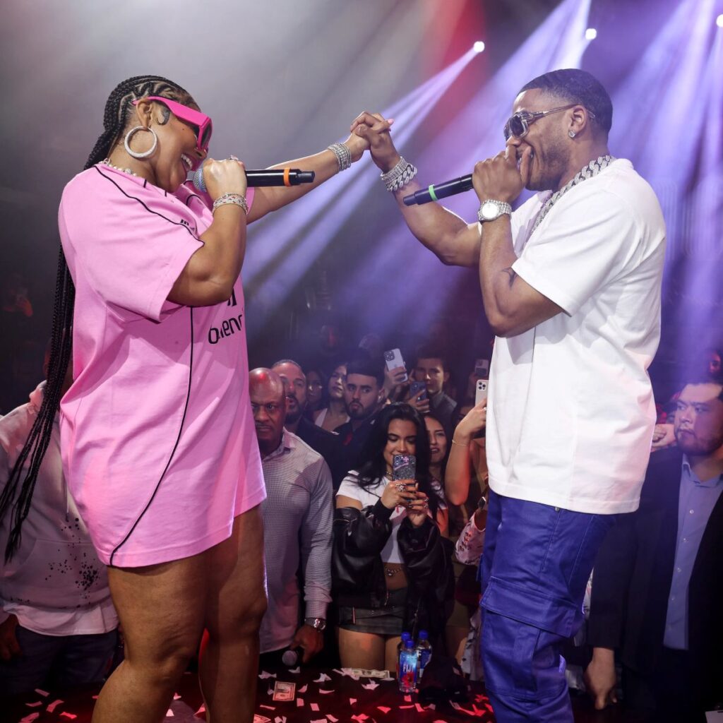 Nelly and Ashanti performing a song