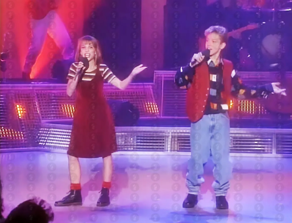 young Britney Spears and Justin Timberlake performing a duet together on The All-New Mickey Mouse Club in 1993
