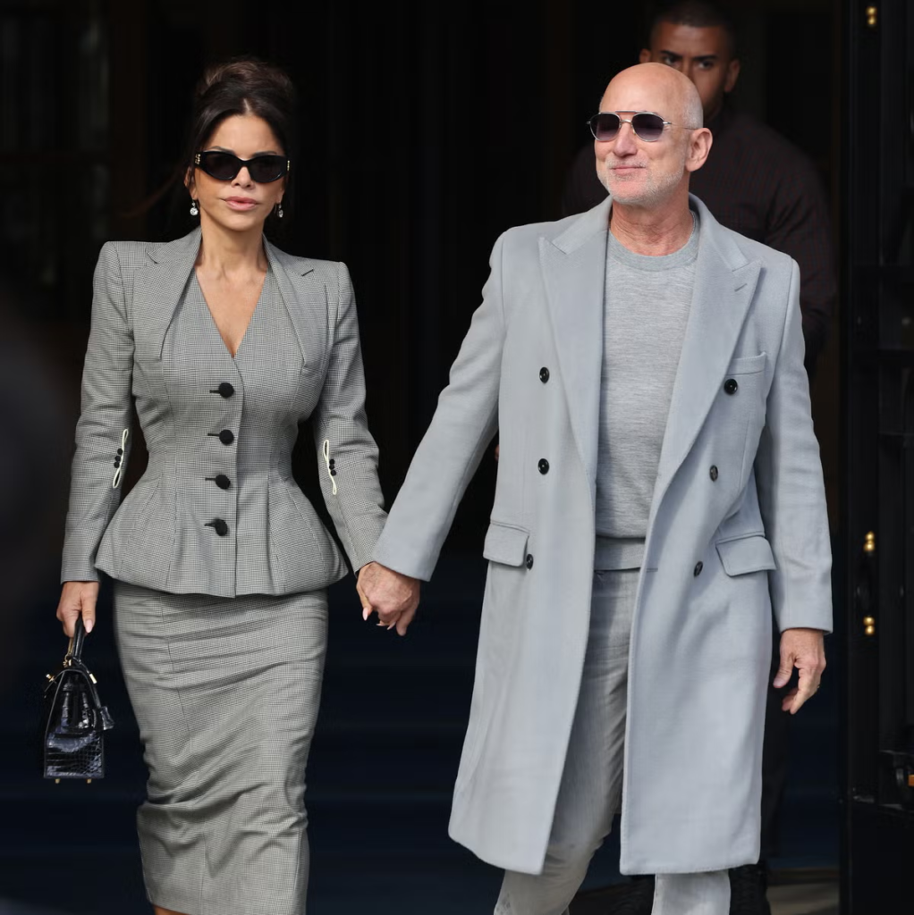 Jeff Bezos and Lauren Sánchez holding hands