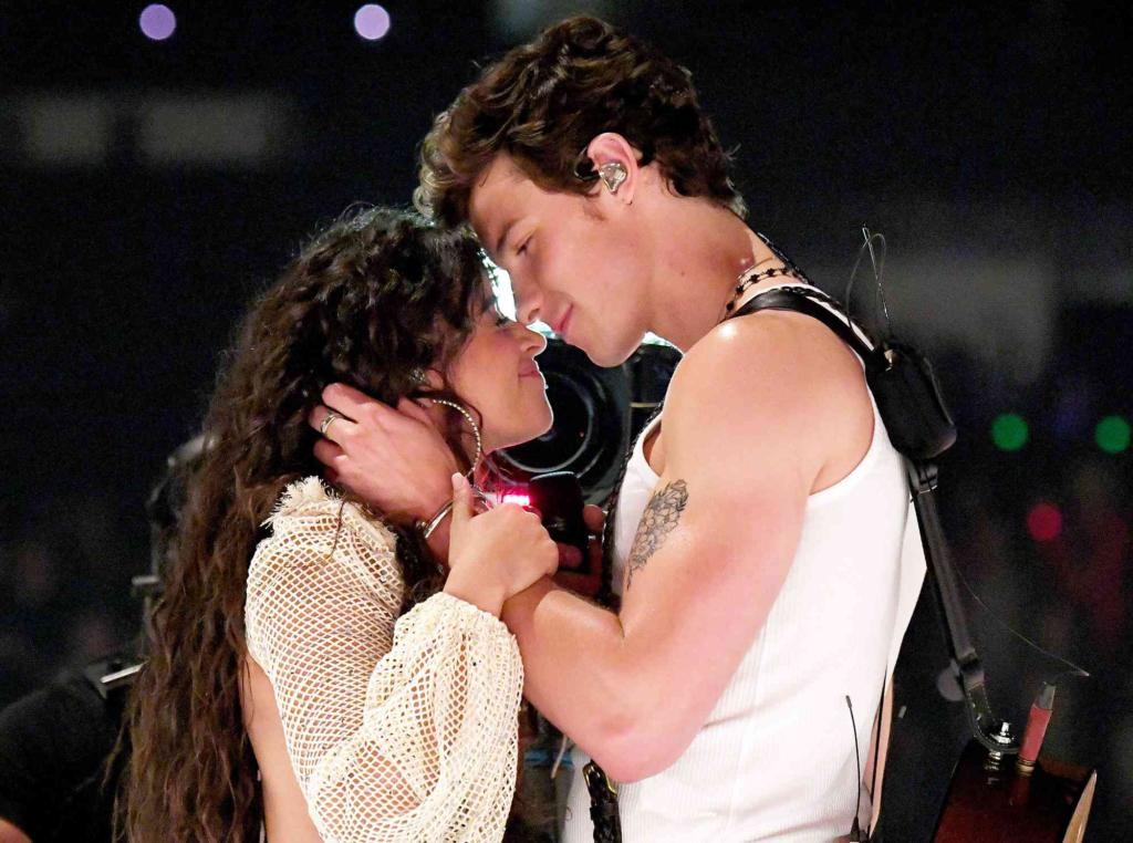 Shawn Mendes and Camila Cabello about to kiss on stage