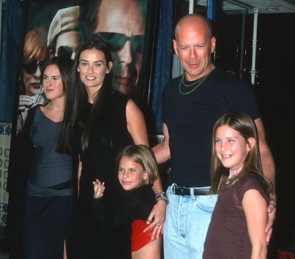 Demi Moore and Bruce Willis with their kids at an event