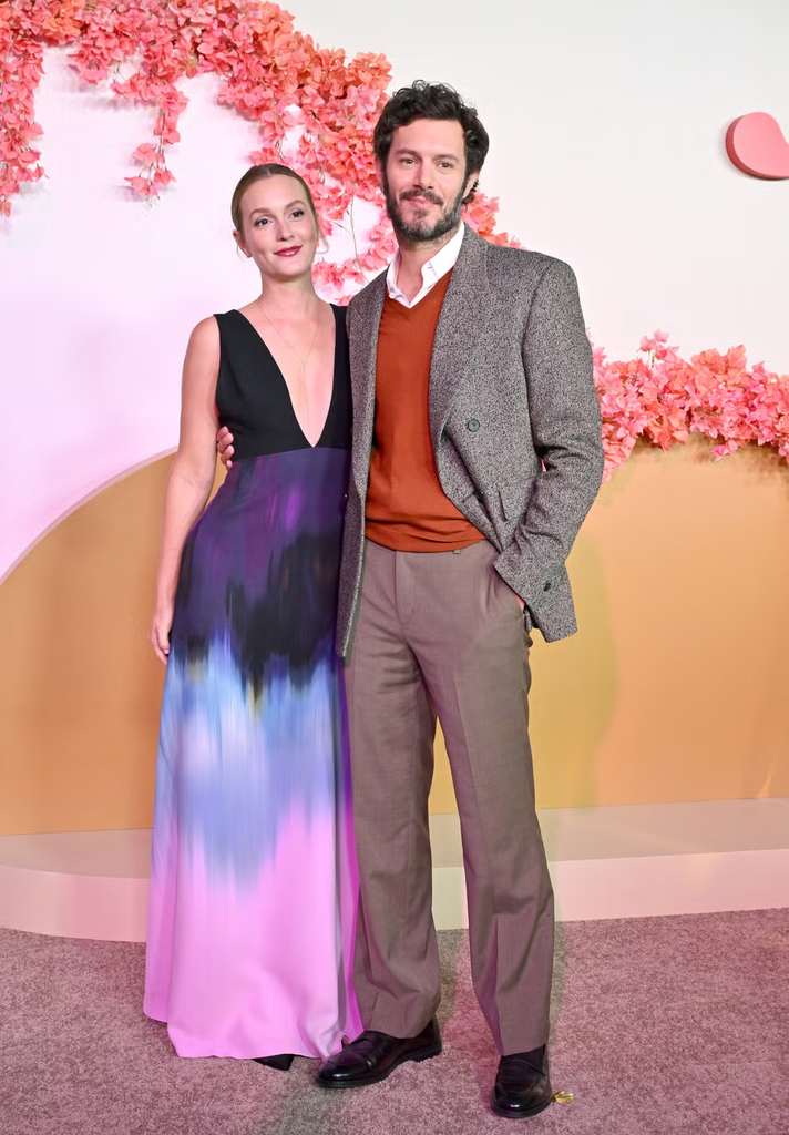 Adam Brody and Leighton Meester at a movie premiere